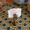 bella-hand-card-holder-doing-goods